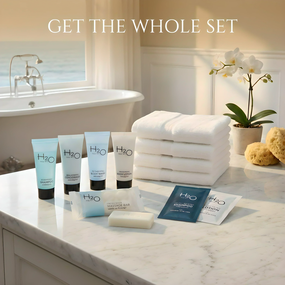 H2O spa toiletries set with shampoo, body wash, lotion, soap, and towels on marble counter in luxury bathroom